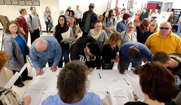 Jobseekers line up for a job fair at Columbia-Greene Community College in Hudson, New York, on April 22, 2014. (AP/Mike Groll)