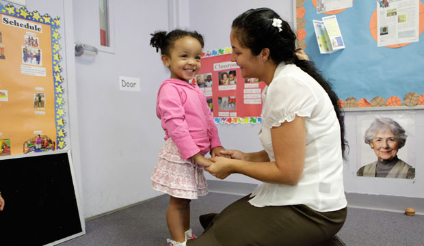 Susan Nyamora talks with her daughter in Pembroke Pines, Florida, in December 2009. (AP/Lynne Sladky)