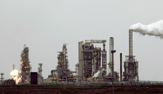 A refinery, including a gas flare flame that is part normal plant operations, in Anacortes, Washington, April 2010. (AP/Ted S. Warren)