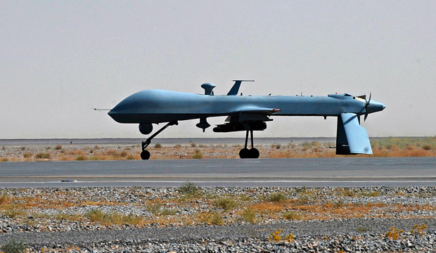 A U.S. Predator unmanned drone armed with a missile stands on the tarmac of Kandahar military airport in Afghanistan on June 13, 2010. (AP/Massoud Hossaini)