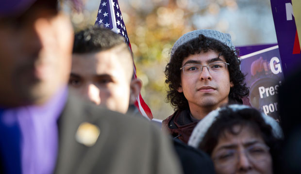 A young man from Colombia who is qualified for the DACA program attends a rally in front of the White House on November 21, 2014. (AP/Jacquelyn Martin)