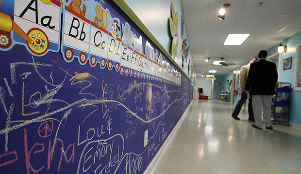 Hallway walls of a preschool are decorated with examples of the alphabet and protected with chalkboards, February 2012. (AP/Rogelio V. Solis)