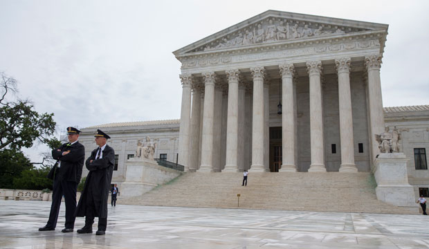 Police stand outside the U.S. Supreme Court in Washington, D.C., on June 23, 2016. (AP/Evan Vucci)