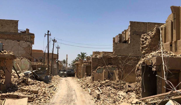 Iraqi security forces enter the al-Julan neighborhood after defeating Islamic State militants in Fallujah, Iraq, on June 26, 2016. (Associated Press)