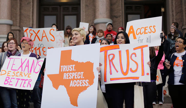 College students and abortion rights activists hold signs during a rally on the steps of the Texas Capitol, in Austin, Texas, on February 26, 2015. (AP/Eric Gay)