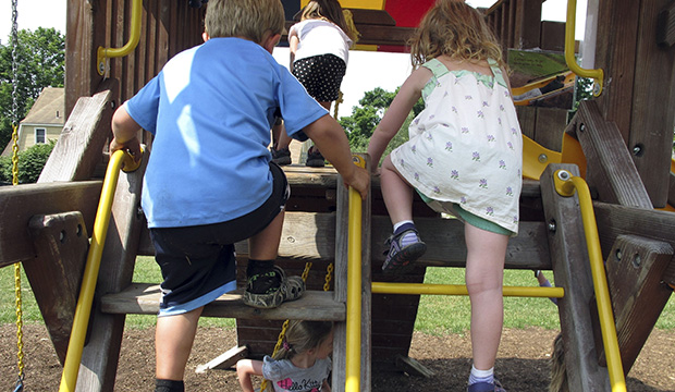 Children climb in the playground at a preschool in Hinesburg, Vermont, July 7, 2016. (AP/Lisa Rathke)