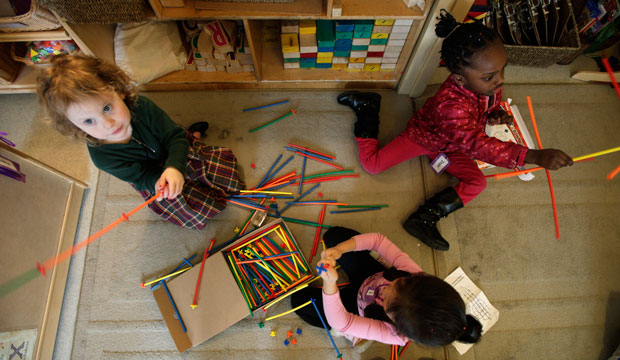 Preschool students build castles with building sticks at the Refugee and Immigrant Family Center in Seattle on April 5, 2012. (AP/Ted S. Warren)