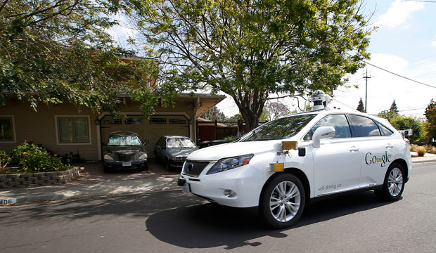A self-driving car drives along a street during a demonstration in Mountain View, California, on May 13, 2015. (AP/Tony Avelar)