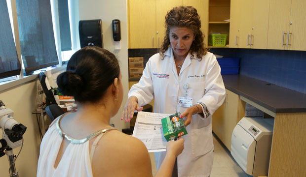 A nurse practitioner gives a pregnant patient information about mosquito protection on August 2, 2016, in Miami. (AP/Lynne Sladky)