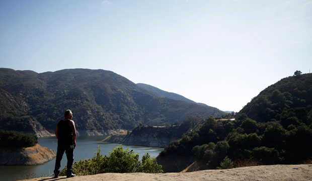 Andy Jimenez looks at the Morris Reservoir in the San Gabriel Mountains, October 8, 2014, near Azusa, California. (AP/Jae C. Hong)