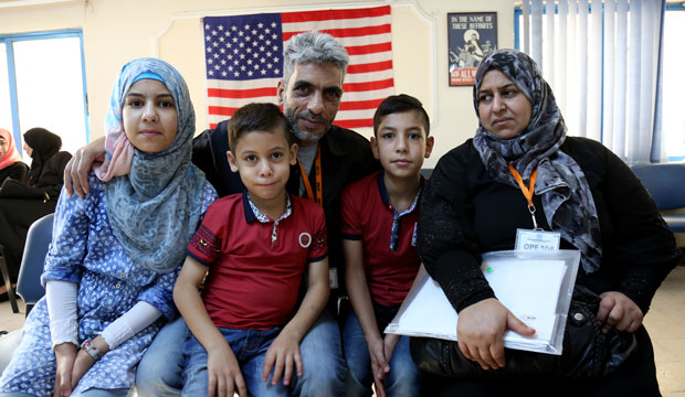 The Jouriyeh family, Syrian refugees headed to the United States, pose in Amman, Jordan, on August 28, 2016. (AP/Raad Adayleh)