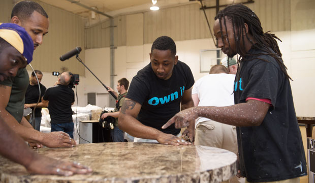 Employees work to remodel a table on April 13, 2016, in Jackson, Mississippi. (AP/James Patterson)