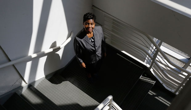 Sandi Webster, owner of Consultants 2 Go, poses in her office in Newark, New Jersey, on September 24, 2013. (AP/Julio Cortez)