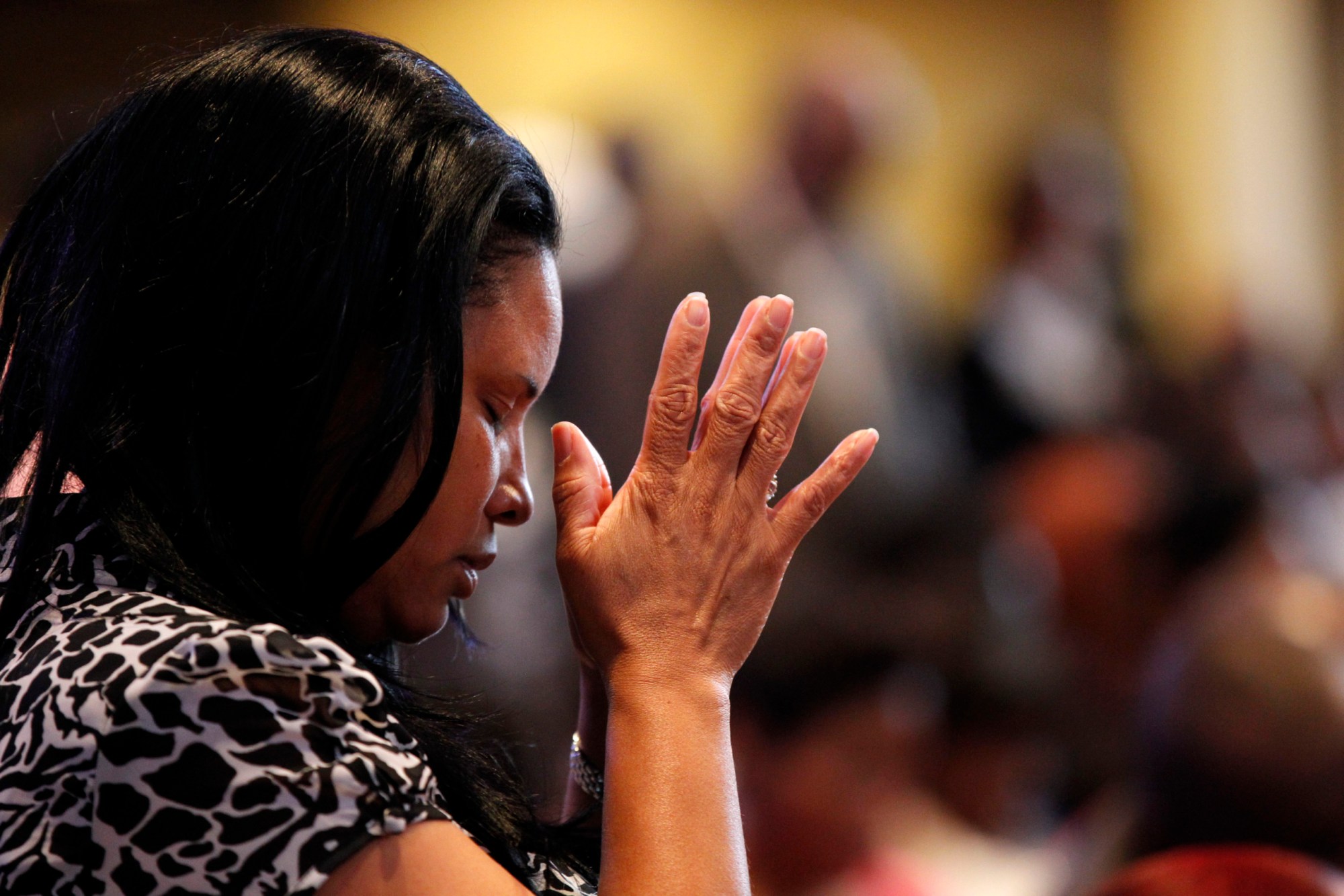 A congregation member prays at Franklin Avenue Baptist Church in New Orleans, June 3, 2012. (AP/Gerald Herbert)