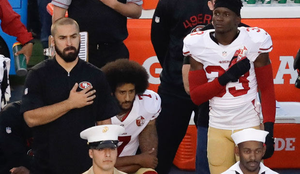 San Francisco 49ers quarterback Colin Kaepernick sits during the national anthem before an NFL preseason football game in San Diego, September 1, 2016. (AP/Chris Carlson)
