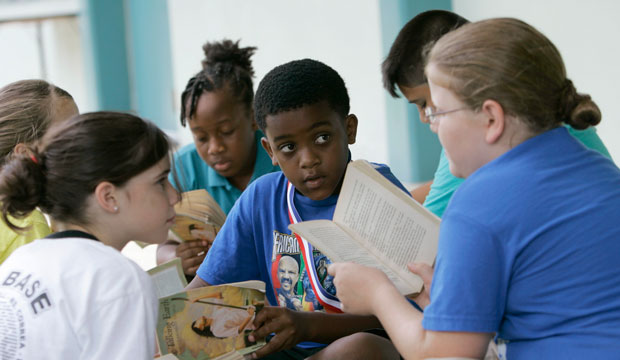 Students read outside of their classroom on June 4, 2009, in Homestead, Florida. (AP/Wilfredo Lee)