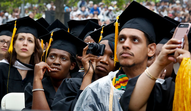 Graduating students listen to a commencement speech on June 3, 2016, in New York. (AP/Bebeto Matthews)