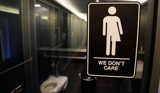 Signage is shown outside of a restroom in Durham, North Carolina, on May 12, 2016. (AP/Gerry Broome)