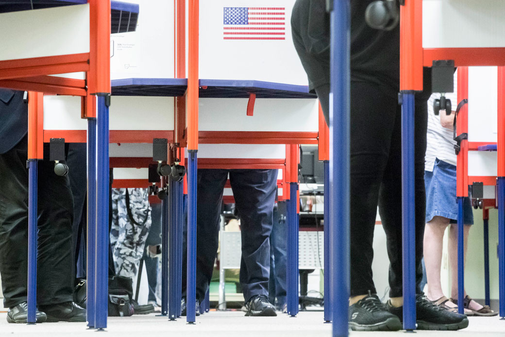 Voters fill out their ballots at the Hamilton County Board of Elections as early voting begins statewide, Wednesday, October 12, 2016, in Cincinnati, Ohio. (AP/John Minchillo)