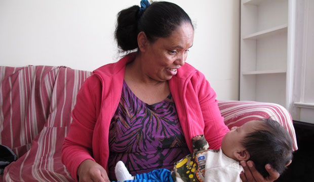 Dilsia Acosta holds her grandson, March 2016. (AP/Allen G. Breed)