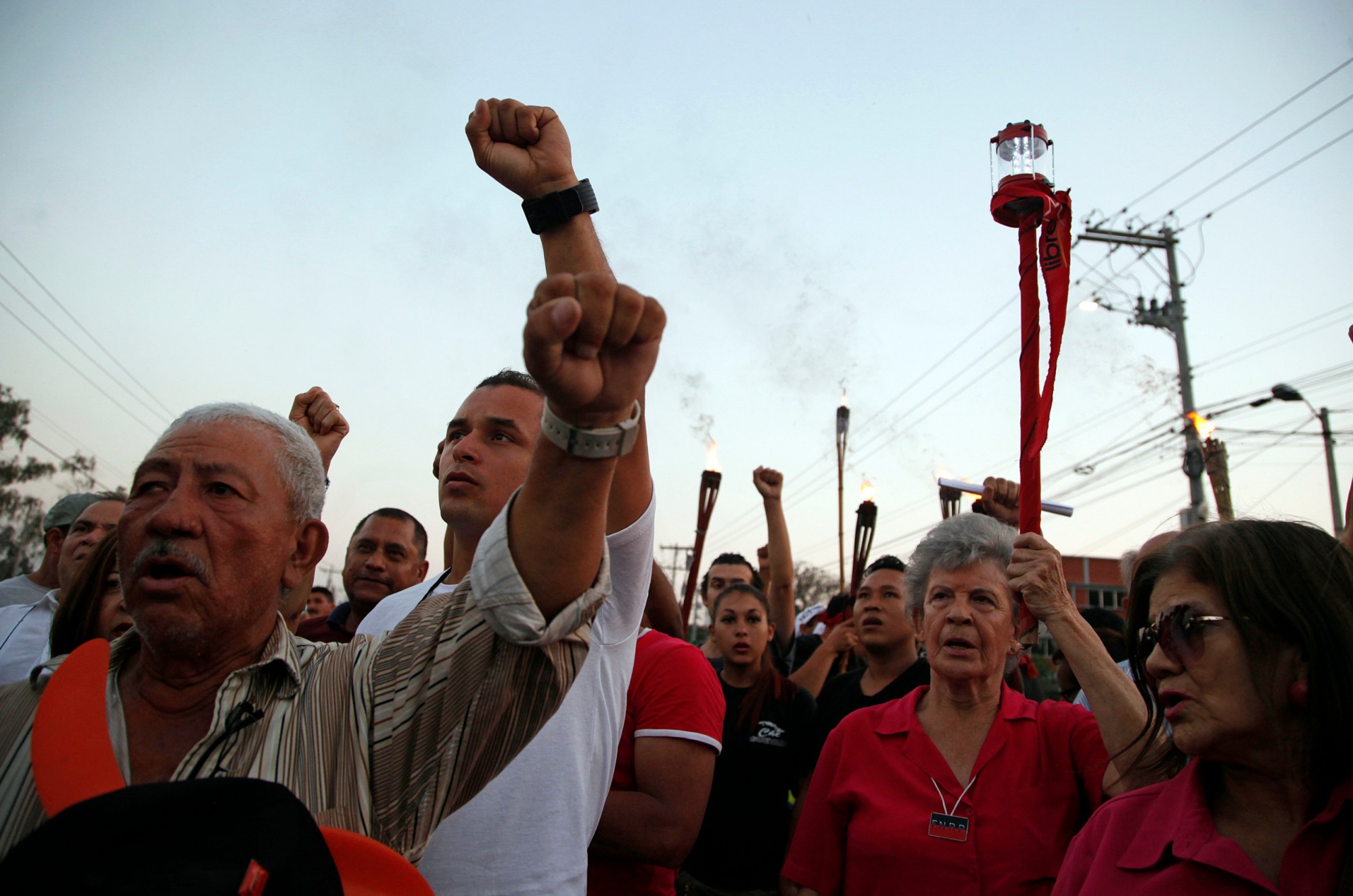 People march in protest to demand justice over the murder of environmentalist and indigenous leader Berta Caceres in Tegucigalpa, Honduras, Friday, April 1, 2016. It has been almost one month since she was shot four times by gunmen who broke into her home. Caceres, who won the 2015 Goldman Environmental Prize pushing a grassroots campaign opposing a controversial dam project, had complained of death threats from police, the army and landowners groups before she was slain. (AP Photo/Fernando Antonio)