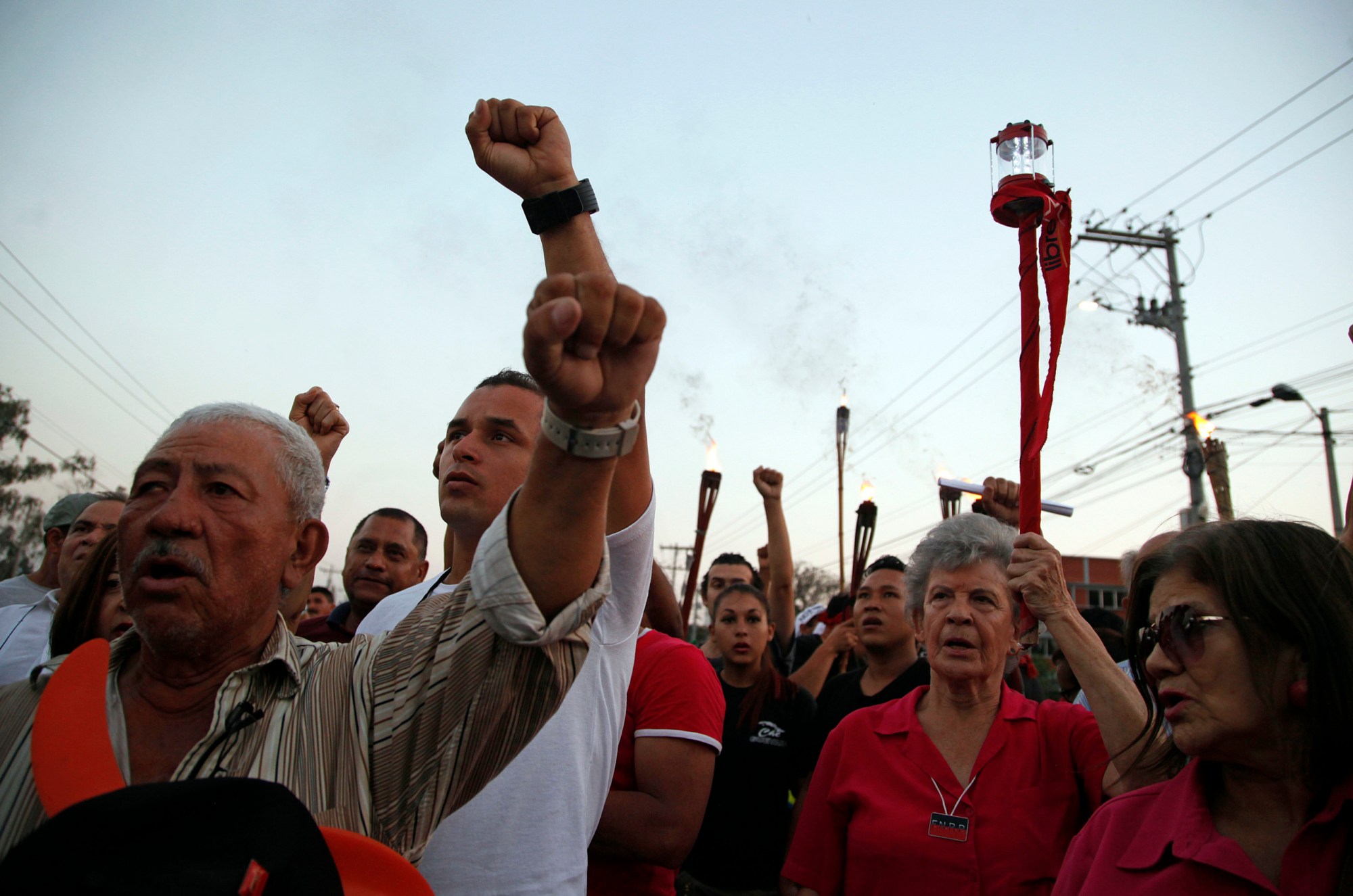 People march in protest to demand justice over the murder of environmentalist and indigenous leader Berta Caceres in Tegucigalpa, Honduras, Friday, April 1, 2016. It has been almost one month since she was shot four times by gunmen who broke into her home. Caceres, who won the 2015 Goldman Environmental Prize pushing a grassroots campaign opposing a controversial dam project, had complained of death threats from police, the army and landowners groups before she was slain. (AP Photo/Fernando Antonio)