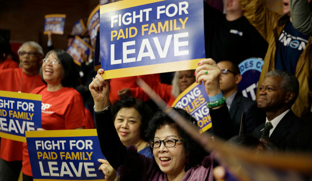 Attendees are seen at a rally for paid family leave in New York, March 10, 2016. (AP/Seth Wenig)