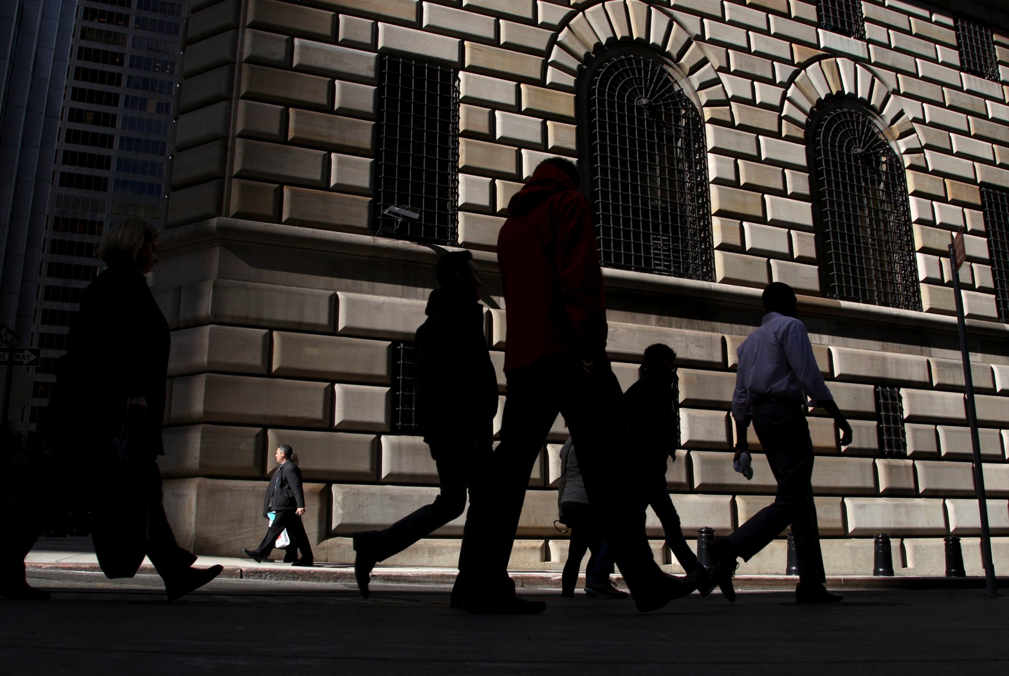 FILE - In this Thursday, Oct. 18, 2012, file photo, pedestrians walk past the Federal Reserve Bank of New York, in New York. On Wednesday, June 15, 2016, the Federal Reserve Bank of New York reports on factory activity in New York in June as indicated by its Empire State manufacturing index. (AP Photo/Seth Wenig, File)