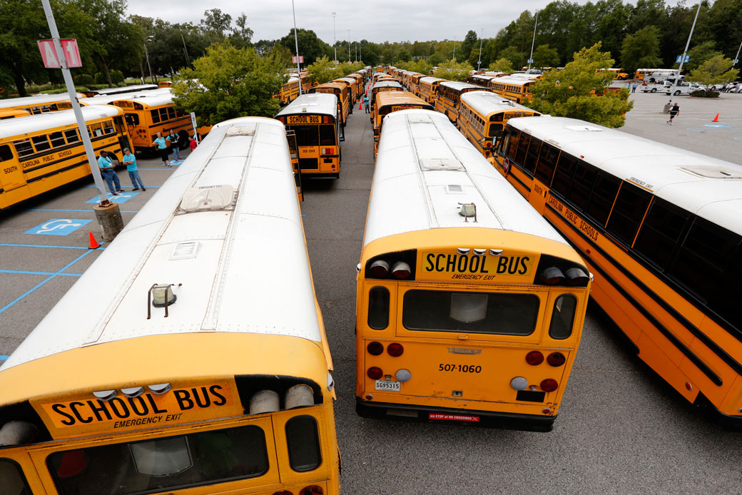 Bus drivers for the Greenville, South Carolina, school district wait by their buses on October 5, 2016. (AP/Mic Smith)