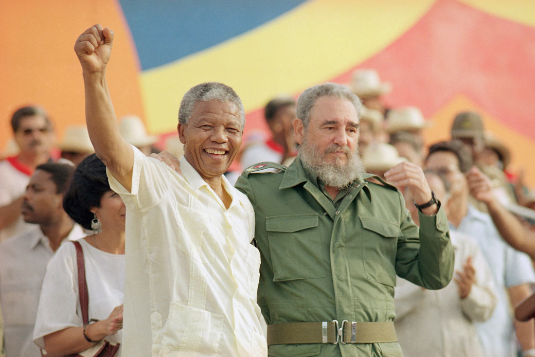 Cuban President Fidel Castro, right, and South African leader Nelson Mandela celebrate the Day of the Revolution in Matanzas, Cuba, on July 27, 1991. (AP)