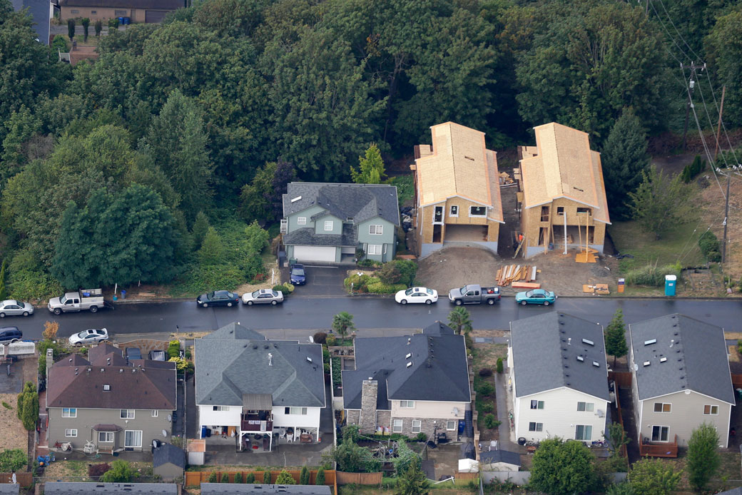 Houses under construction are seen in a Seattle neighborhood, on August 2, 2014. (AP/Ted S. Warren)