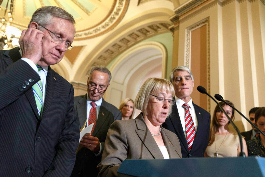 Four U.S. senators talk to reporters on Capitol Hill in Washington, D.C., on July 16, 2014. (AP/J. Scott Applewhite)