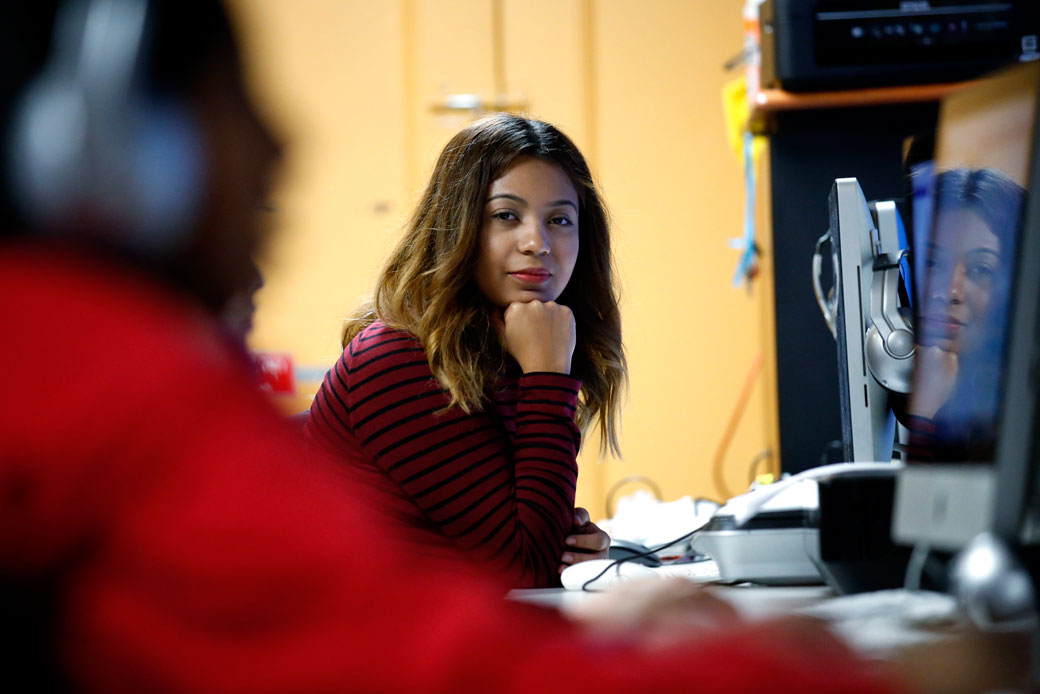 Andrea Aguilera, who has been able to get a work permit and avoid deportation through DACA, sits at a computer in Chicago on November 17, 2016. (AP/Nam Y. Huh)
