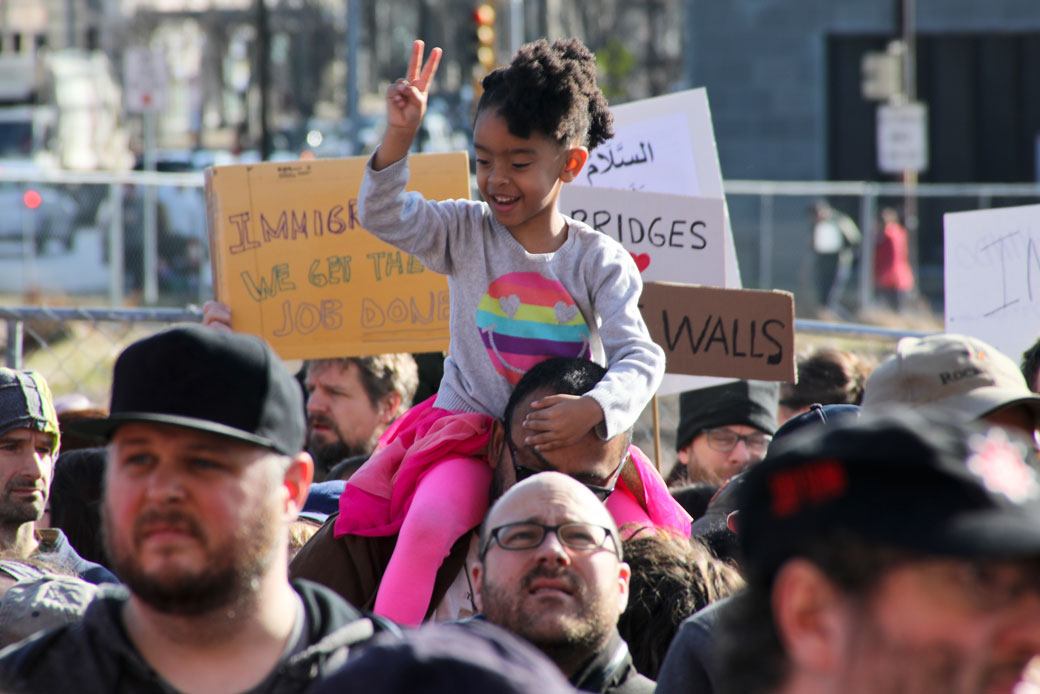 A youngster gives a peace sign in Pittsburgh during one of the women's marches held across the country on January 21, 2017. (AP/Keith Srakocic)