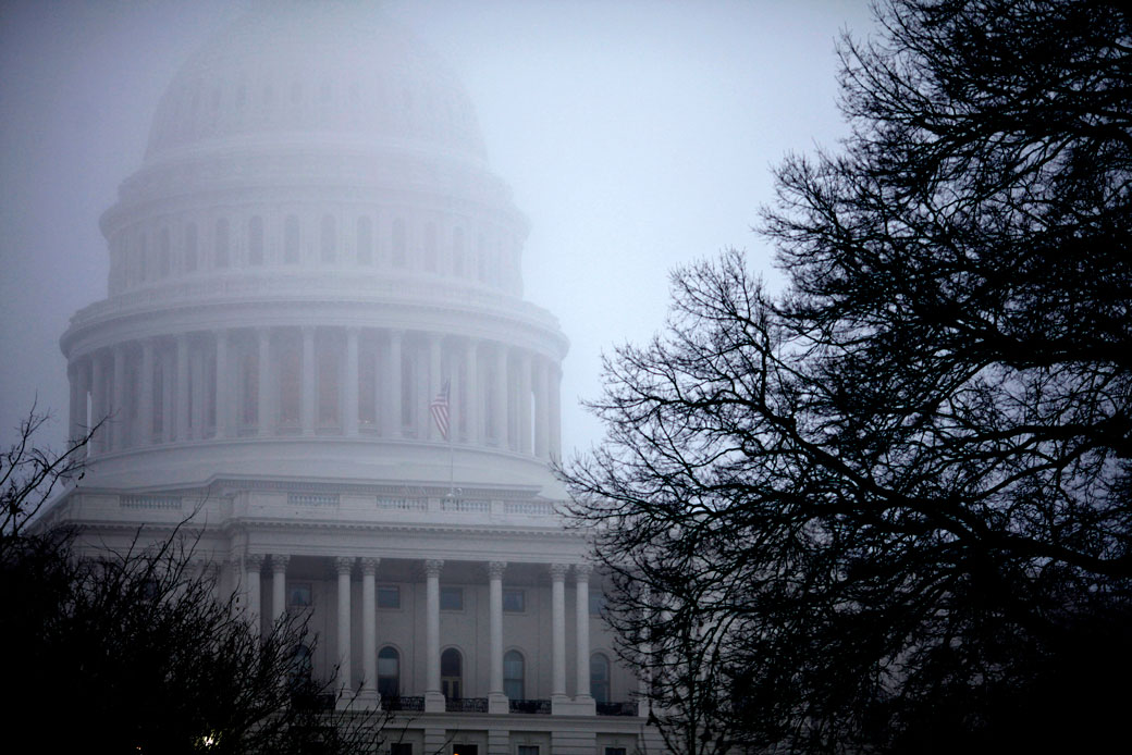In this December 2012 photo, fog obscures the Capitol dome in Washington. (AP/J. Scott Applewhite)