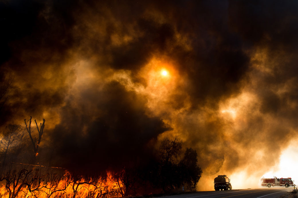 In this August 17, 2016, photo, firefighters battle a wildfire in Keenbrook, California. (AP/Noah Berger)