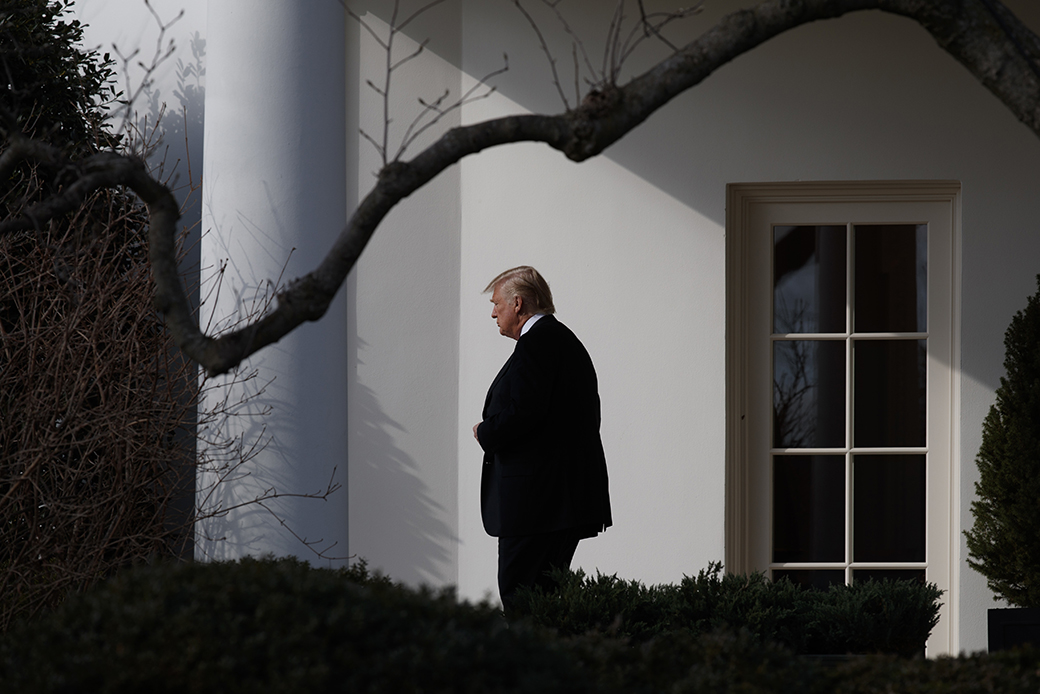 President Donald Trump walks from the Oval Office to board Marine One on the South Lawn of the White House in Washington, January 26, 2017. ((AP/Evan Vucci))