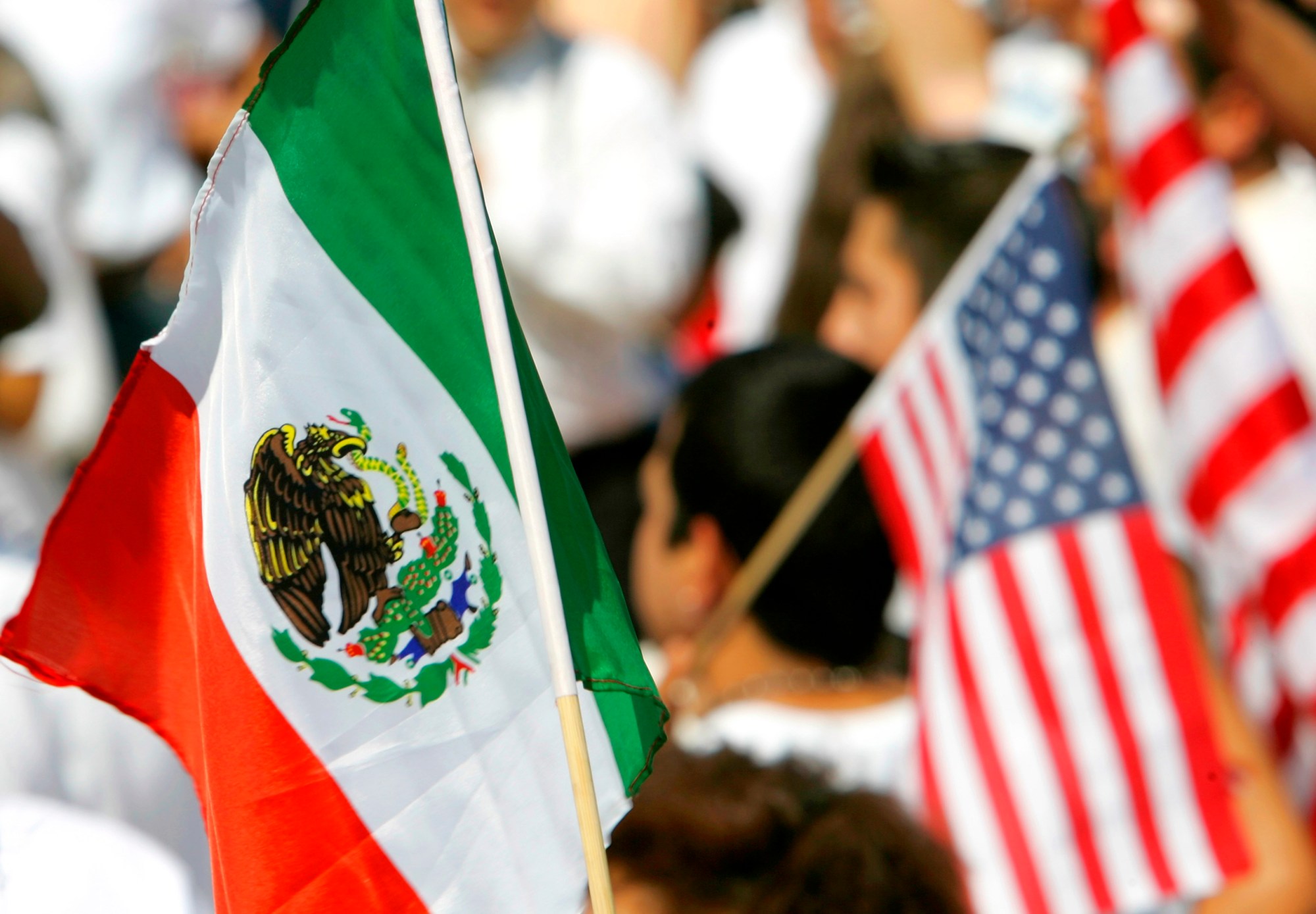 Demonstrators carry Mexican and U.S. flags at the State Capitol in Little Rock, Arkansas, at a rally for comprehensive immigration reform, April 2006. ((AP/Danny Johnston))