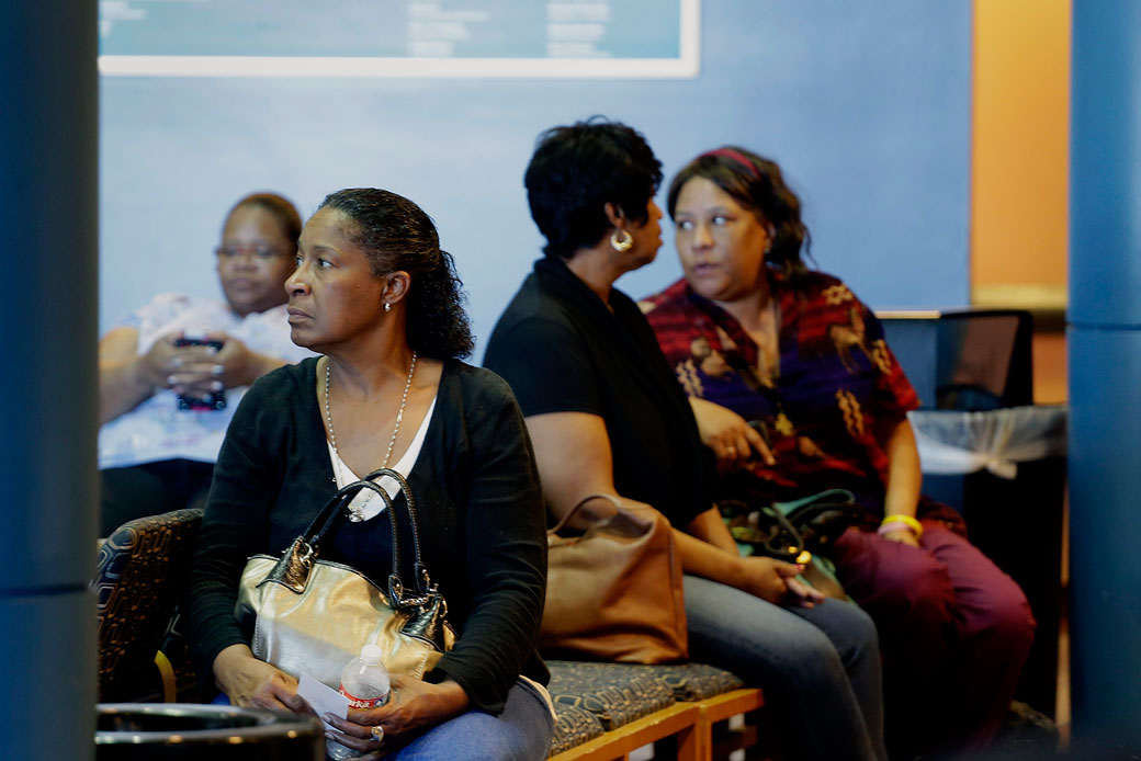 People wait to sign up for the Affordable Care Act at Swope Health Services in Kansas City, Missouri, on March 31, 2014. (AP/Charlie Riedel)