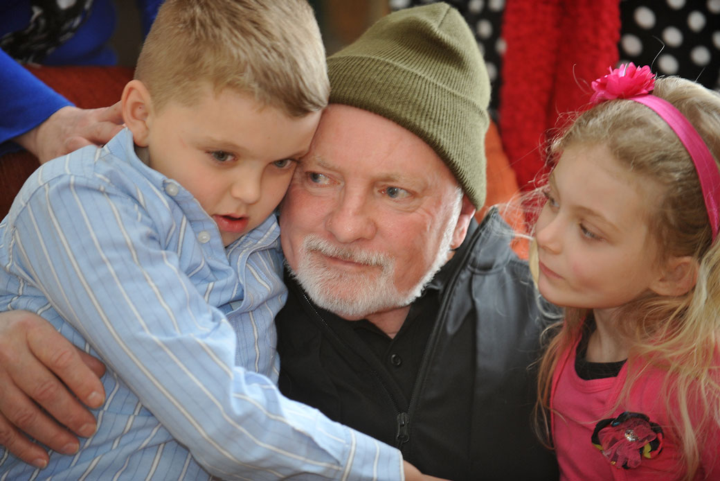 Morris Bounds Sr. sits with his grandchildren on February 23, 2015, in Ansted, West Virginia. (AP/Chris Tilley)