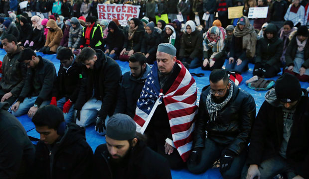 Rutgers University students and supporters gather for Muslim prayers during a rally to express discontent with President Donald Trump's executive order halting some immigrants from entering the United States on Tuesday, January 31, 2017, in New Brunswick, New Jersey. (AP Photo/Mel Evans)