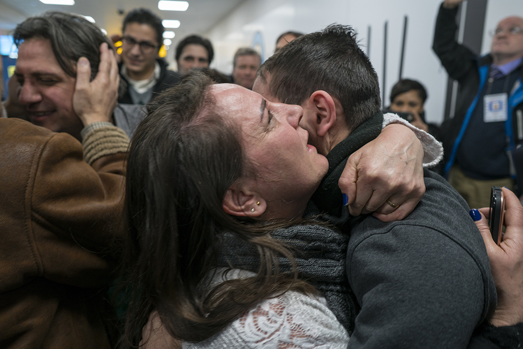 Family members who have just arrived from Syria embrace and are greeted by family who live in the United States upon their arrival at John F. Kennedy International Airport in New York, February 6, 2017. ((AP/Craig Ruttle))