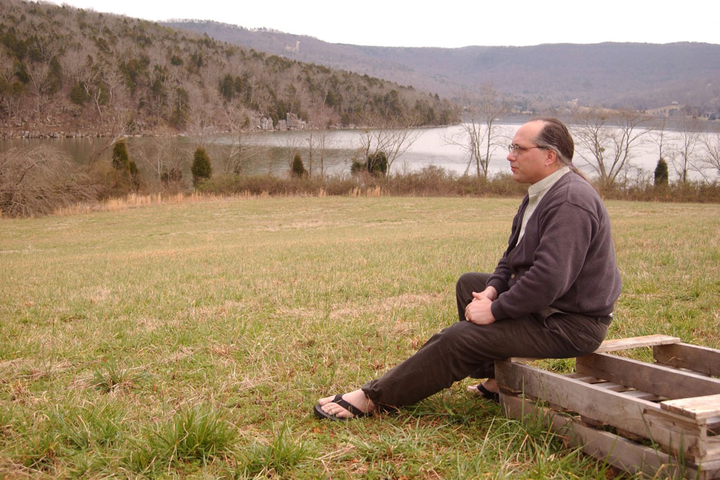 A man sits near Nickajack Lake in Marion County, Tennessee, on March 15, 2005. (AP/Mark Gilliland)