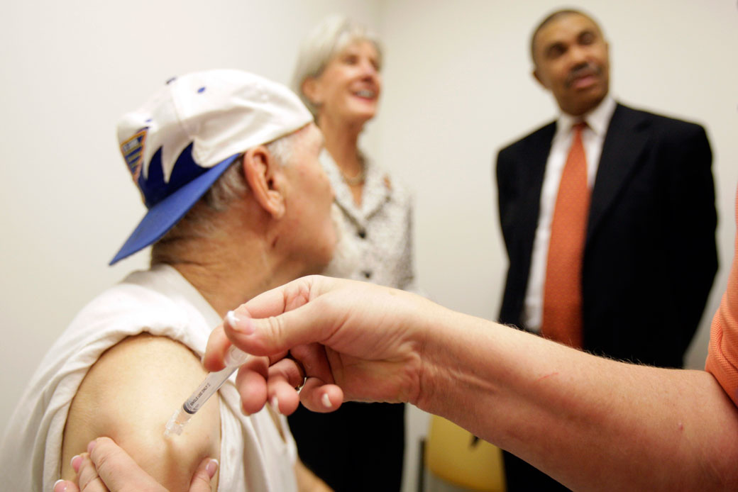 Mike Castling is injected as part of a clinical study of the H1N1 vaccine in St. Louis in 2009. (AP/Jeff Roberson)