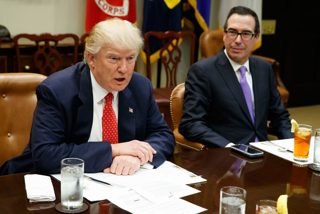Treasury Secretary Steven Mnuchin listens as President Donald Trump speaks during a meeting on the federal budget on February 22, 2017, in the White House. (AP/Evan Vucci)