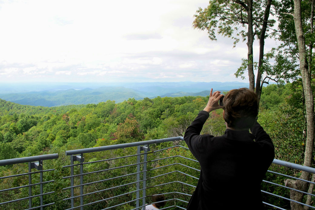 A visitor takes a photograph from the top of Sassafras Mountain, the highest peak in South Carolina, on September 27, 2014. (AP/Bruce Smith)