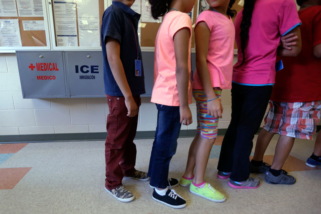 Detained immigrant children line up in the cafeteria at the Karnes County Residential Center in Karnes City, Texas. (AP/Eric Gay)