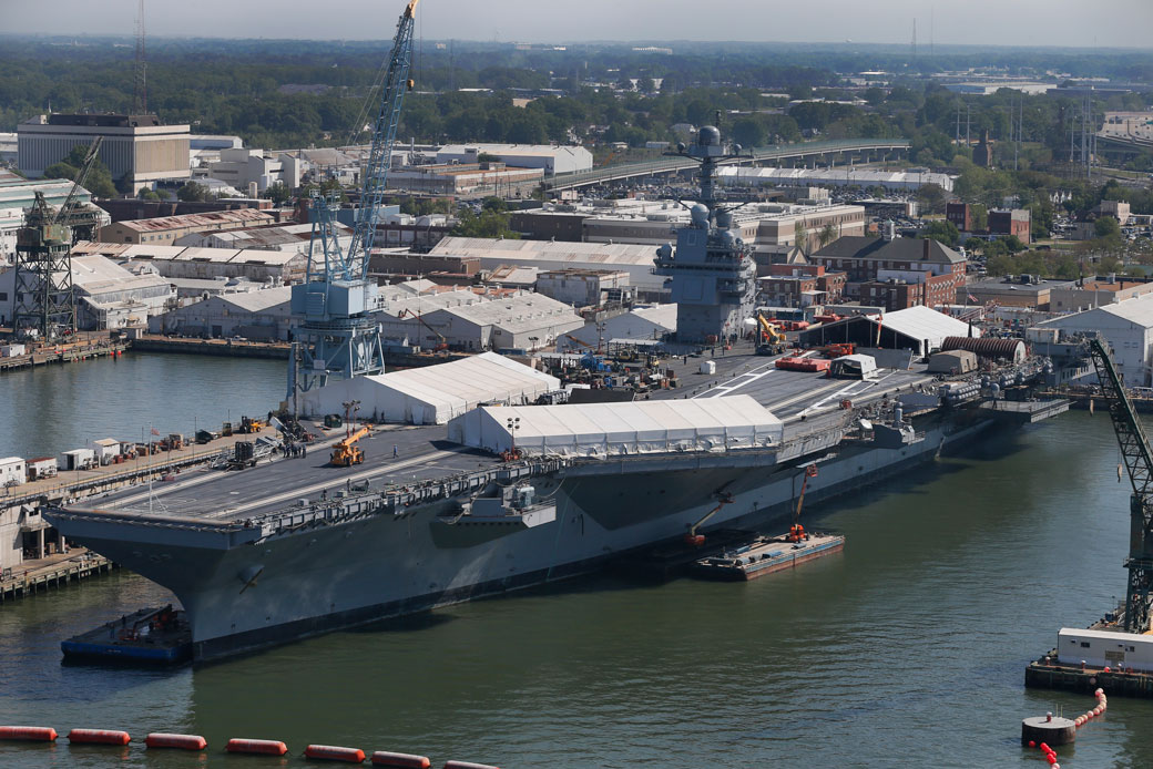 The USS Gerald R. Ford is stationed at Newport News Shipbuilding in Newport News, Virginia on April 27, 2016. The construction of this $12.9 billion warship faced cost overruns and a construction delay of more than one year. (AP/Steve Helber)