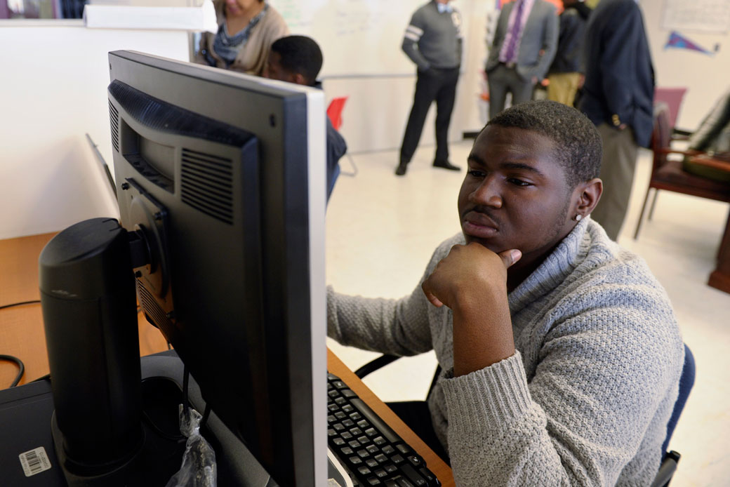 Antwan Williams, a senior at Roosevelt High School, fills out a college enrollment application at his school in Washington on November 14, 2013. (AP/Susan Walsh)