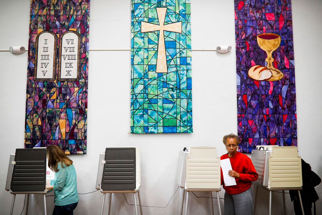 Voters are seen at a polling place inside a Presbyterian church in Cincinnati on November 8, 2016. (AP/John Minchillo)
